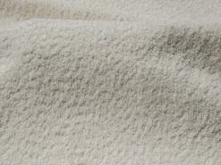 Grande sofá de canto direito convertível em tecido bouclé POGNI da*Maison Céphy Discount